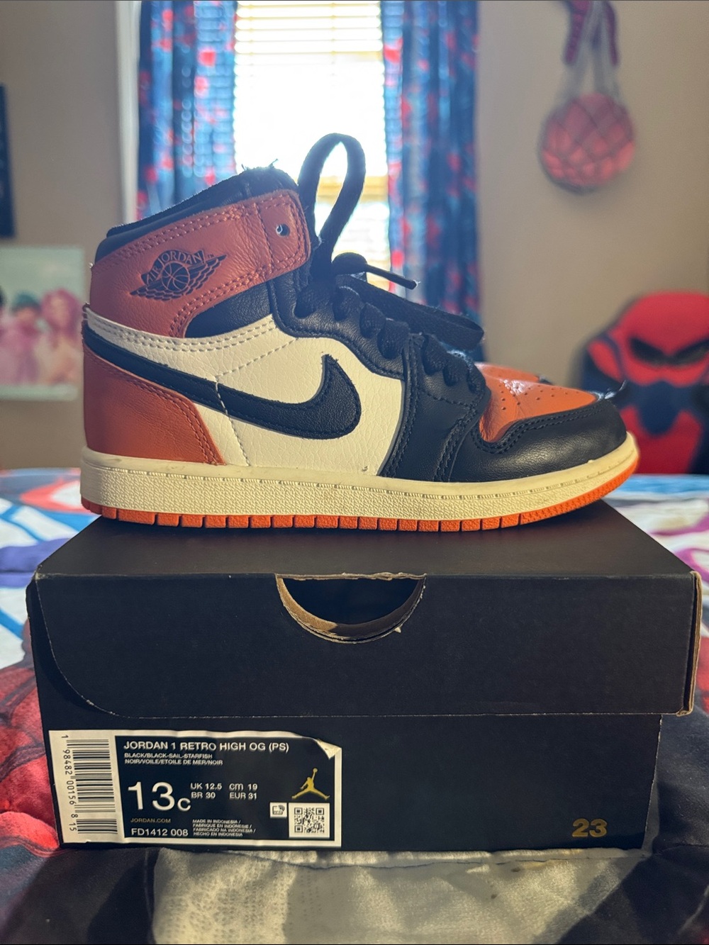 Jordan High-Top Sneaker in Black, White & Orange